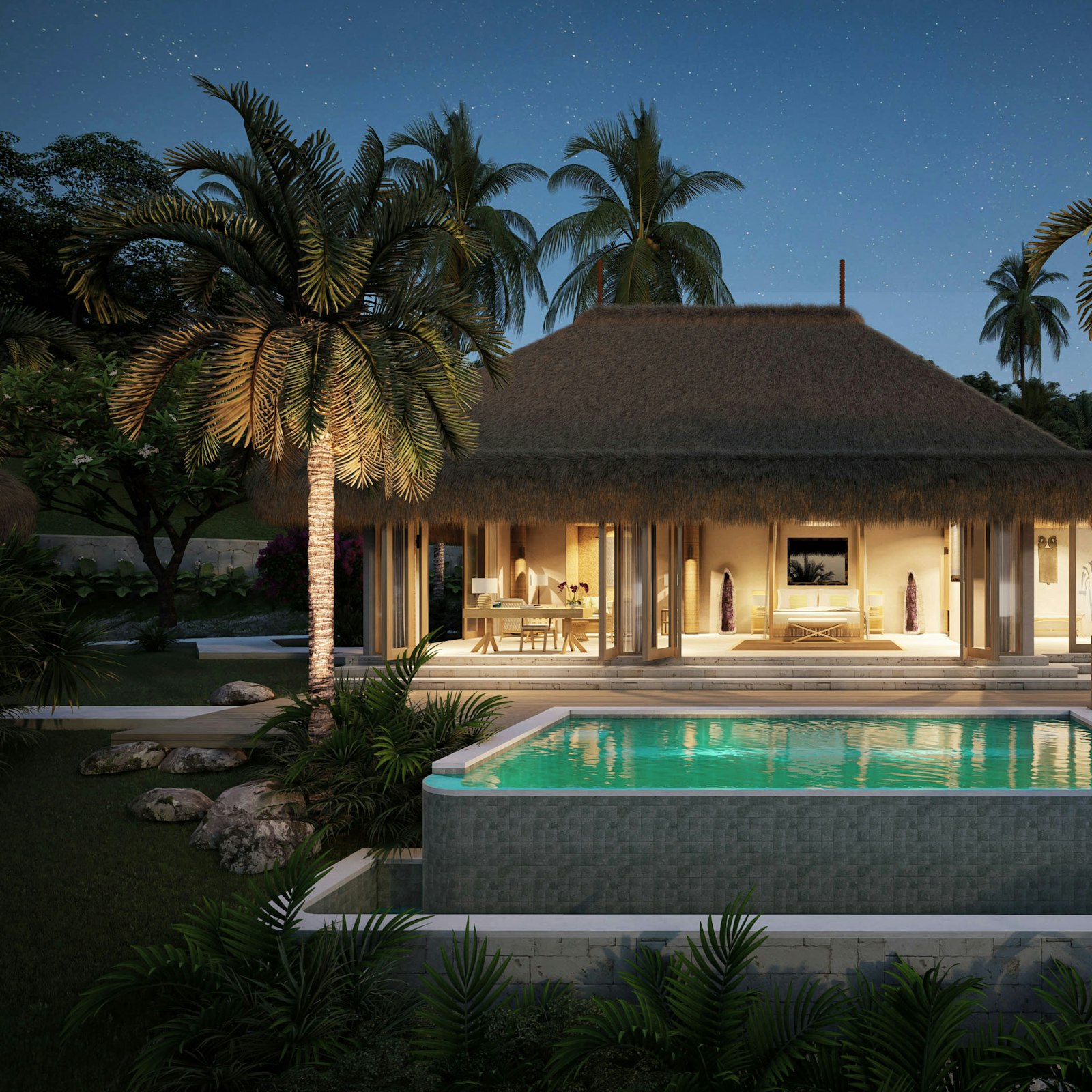 Pool surrounded by tropical greenery